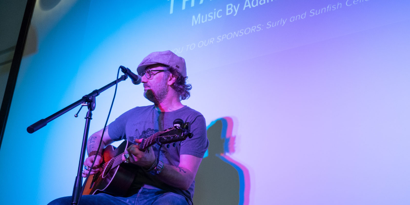 Adam Levy playing a guitar