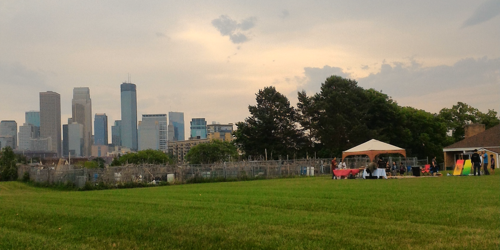 Downtown Minneapolis skyline above community garden